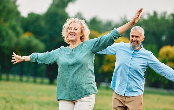 Older couple having fun outside
