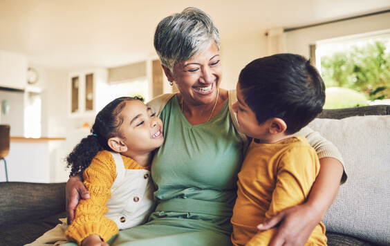 Grandmother cuddling with her grandchildren