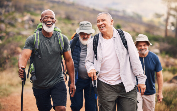 Hiking, smile and group of old men on mountain for fitness, trekking and backpacking adventure