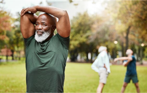 People stretching in a field