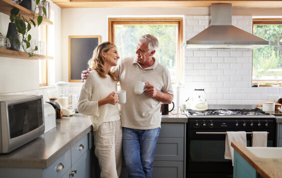 Senior, couple and drinking coffee with a love, marriage and happiness morning mindset at home