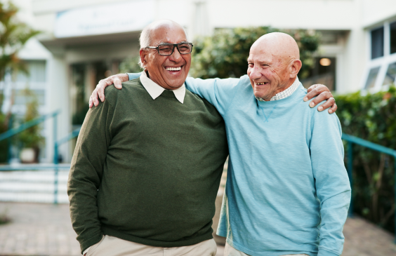 two older men hugging