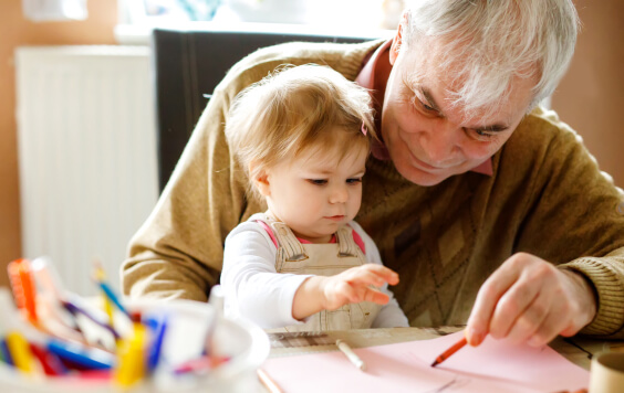 Granddad drawing with his grandchild