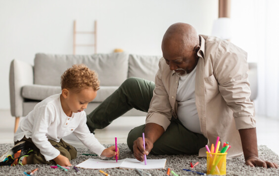 Grandparent drawing with grandchild