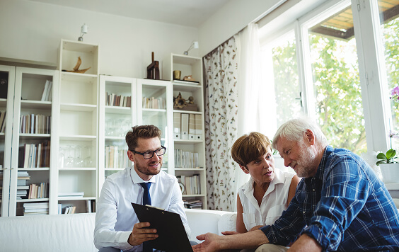 Older couple chatting with adviser