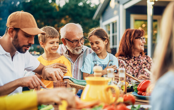 Group of people enjoying food and drinks outside