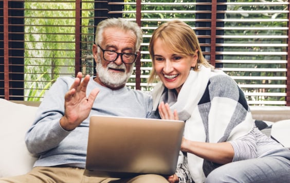 family smiling looking out of window