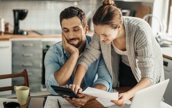 Young couple looking over finances