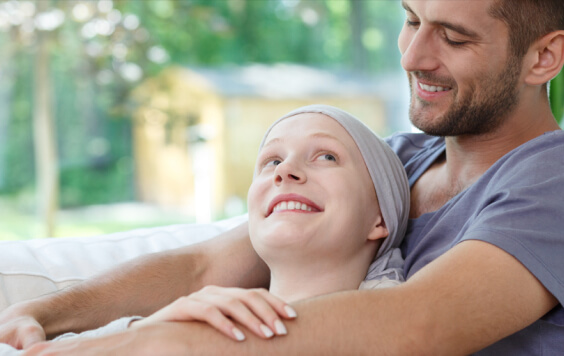 Couple cuddling and smiling