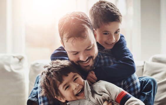 Dad laughing with his kids
