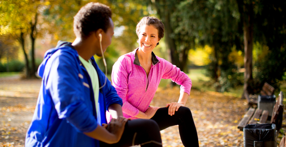 Couple stretching in the forest