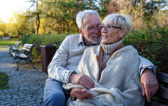 Older couple sitting on a bench